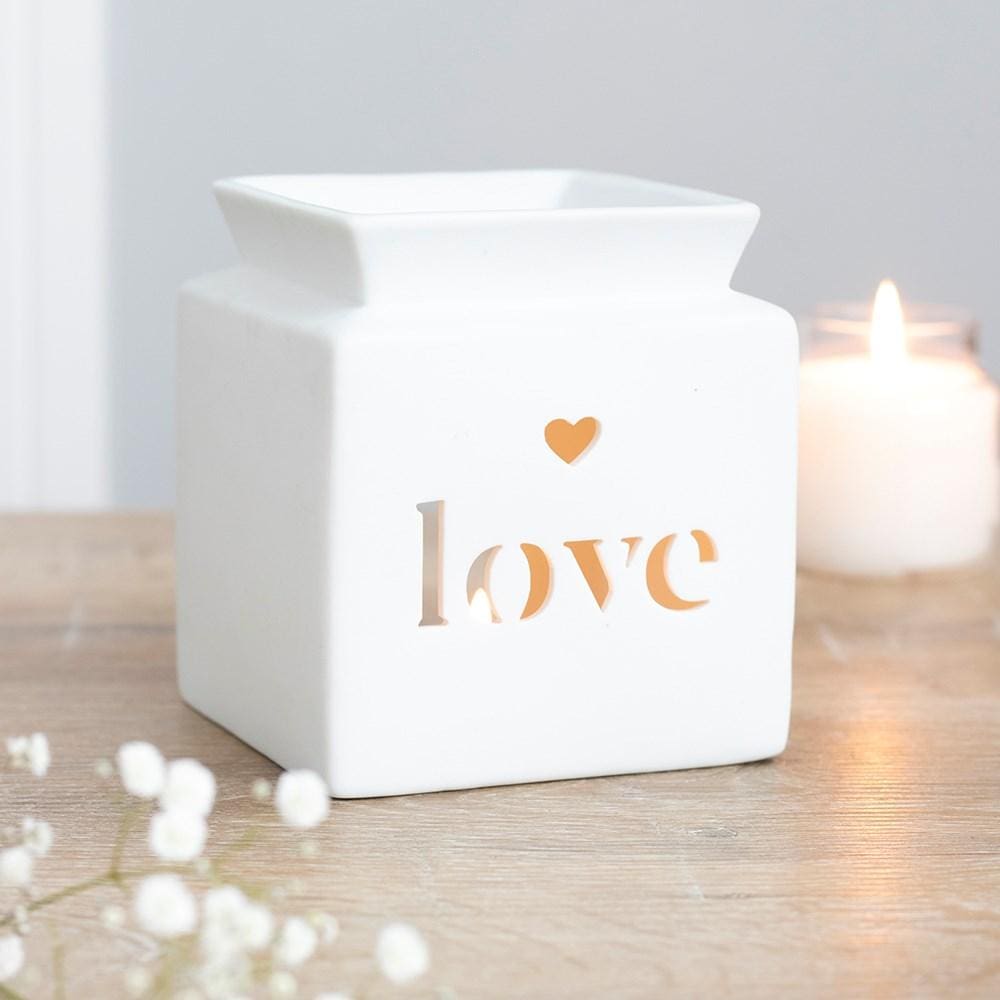 Picture of a White Ceramic Oil and Wax Melt Burner, with the word 'Love' cut out