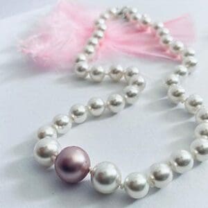 white on pink pearl necklace