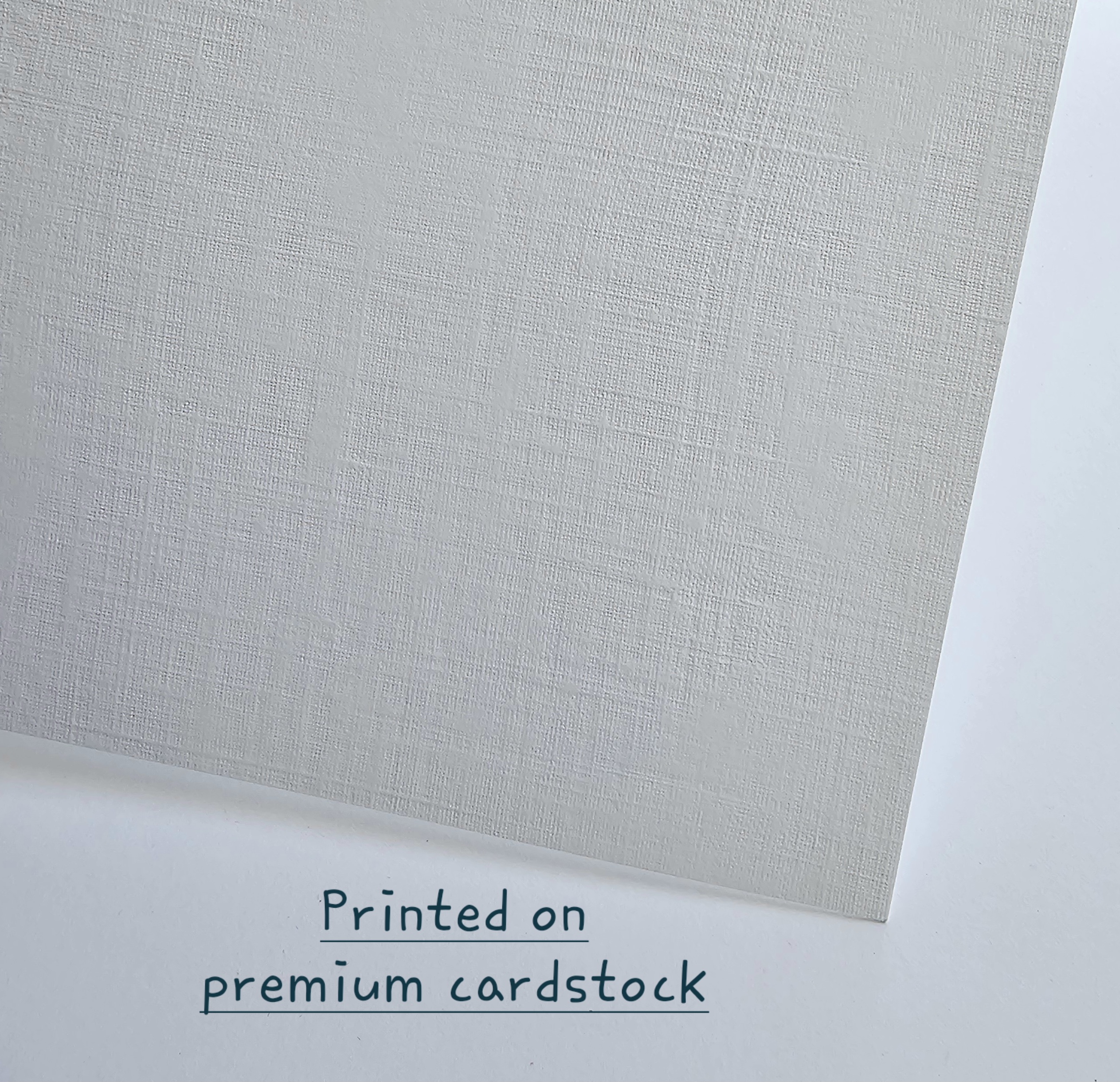 Texture Image Close-up of the premium white linen-textured card stock
